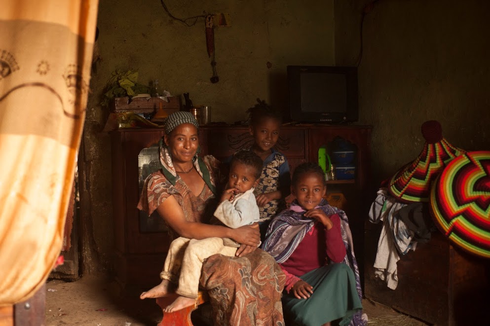 An Ethiopian family sits in their home
