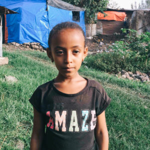 child standing for a portrait