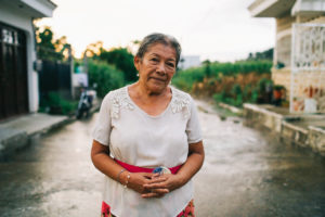 CarePoint Leader, Almita, standing in front of a lush street