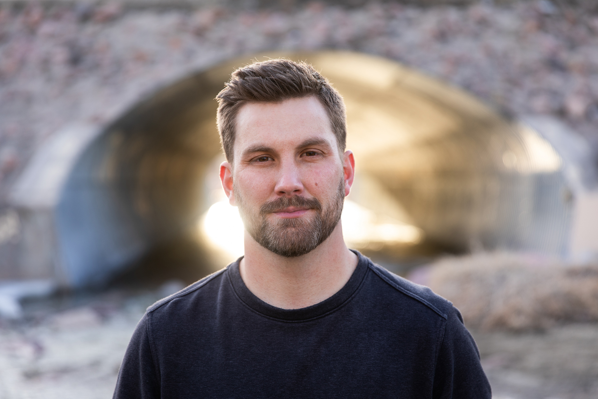 HopeChest employee stands in front of a tunnel