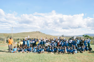 Children in Kenya holding up photos of their HopeChest Friends