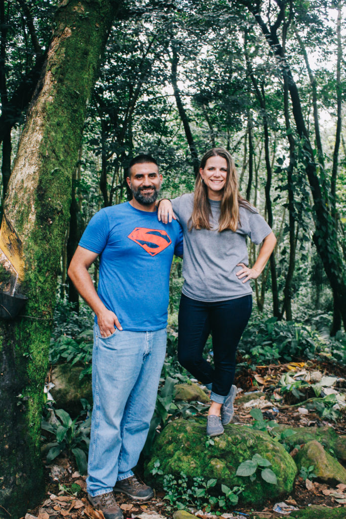 Rachel standing on a rock to look taller next to Sam