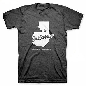 Product Image Dark grey teeshirt with white outline of Guatemala and a small heart over CarePoint Location. Click for more purchasing details.