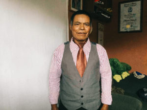 A Guatemalan man standing in an office