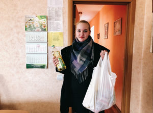 CarePoint participant holding supplies