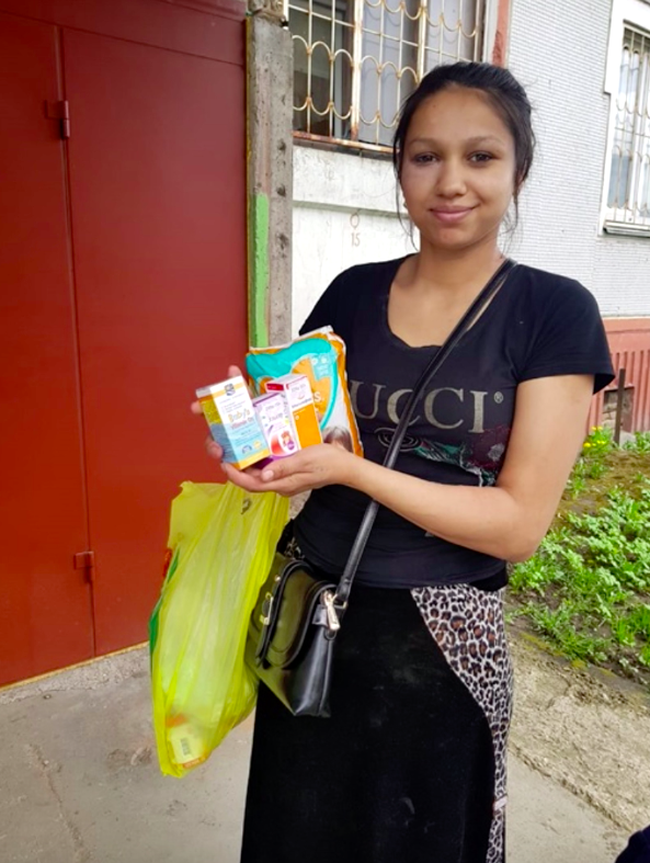 Young mother holding supplies from CarePoint