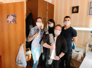 Russian youth wearing masks that they made