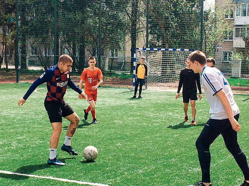 boys in Russia playing soccer in a field