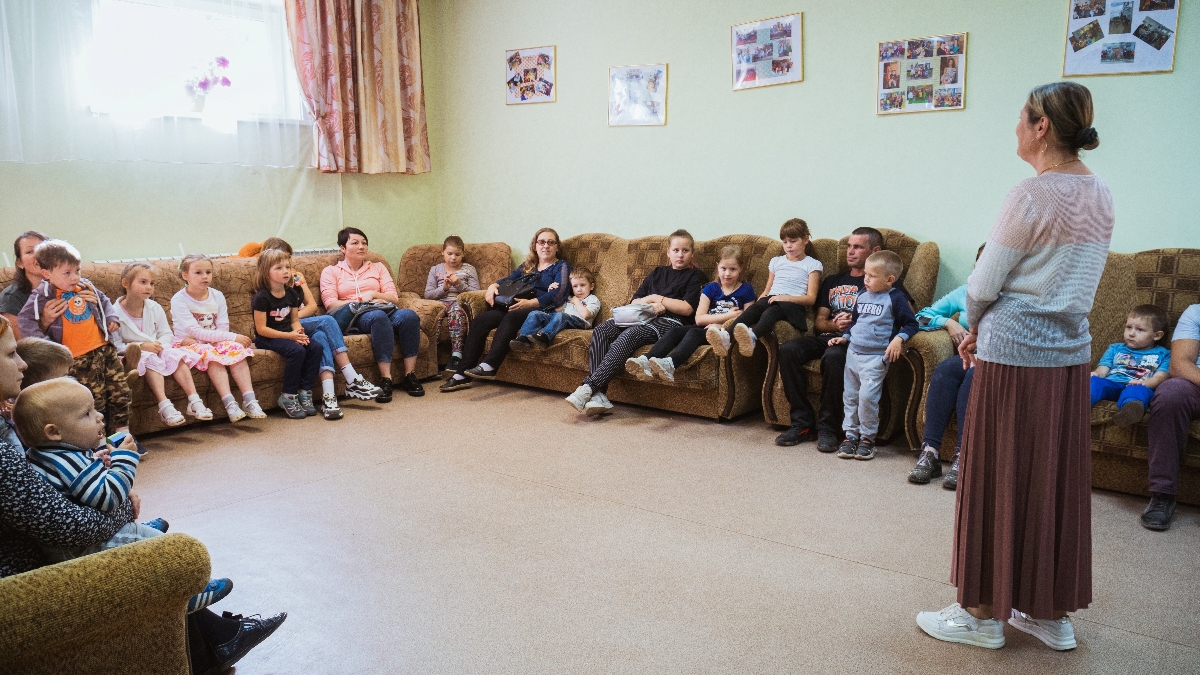 Russian families sitting in a circle