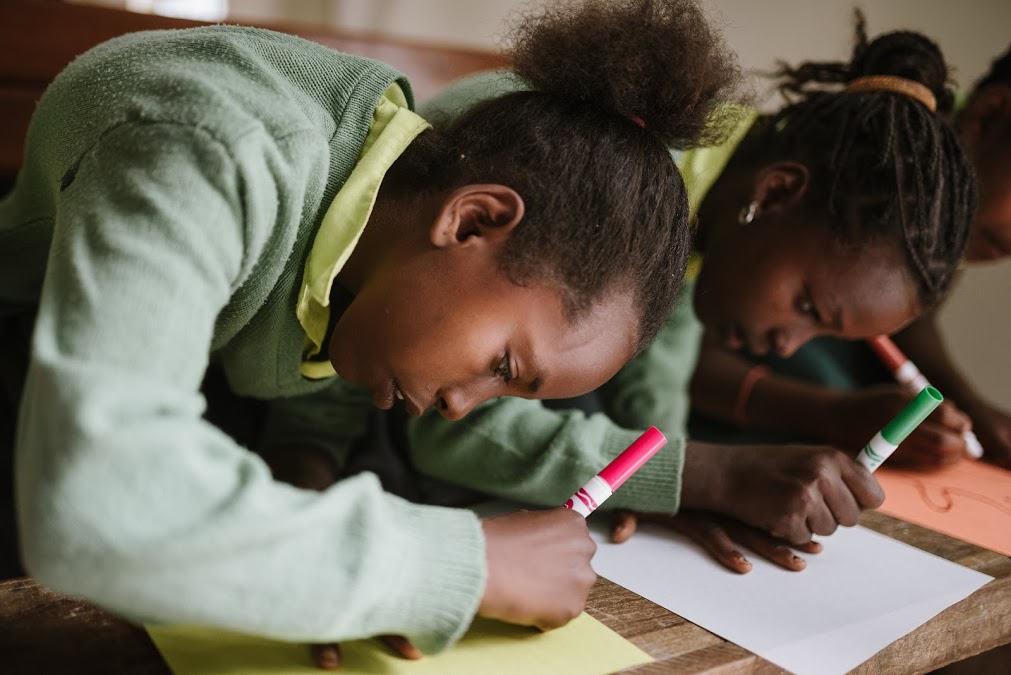 Ethiopian students coloring with markers