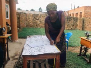 Resta at a cloth, sewing table