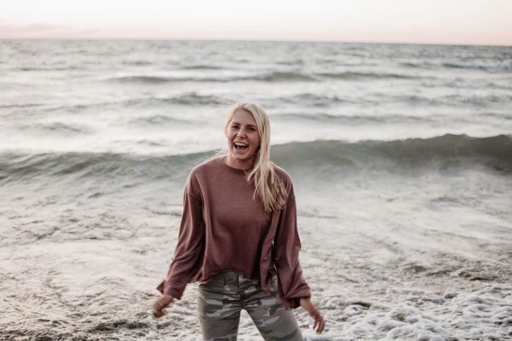 Audrey standing in front of the ocean