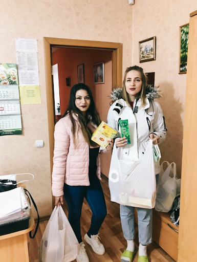 Two young women holding groceries in Russia