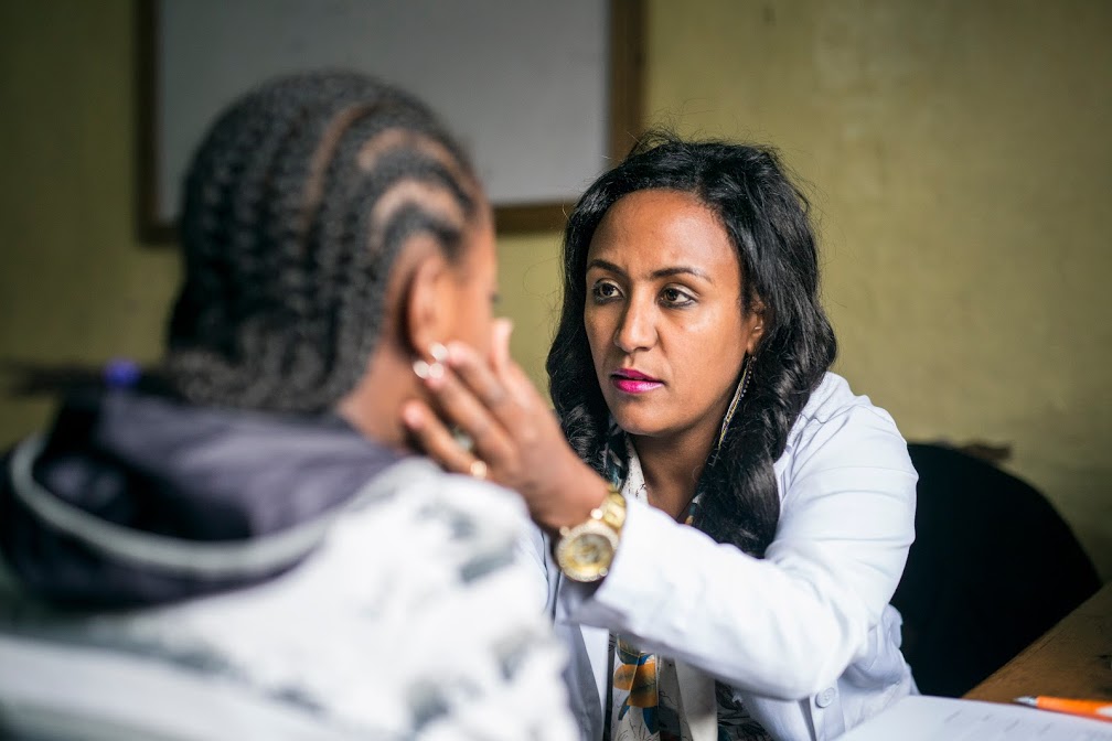healthcare worker in Ethiopia examining a child
