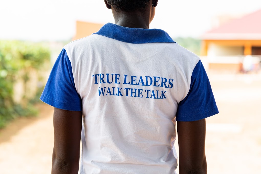 woman wearing a "true leaders walk the talk" shirt