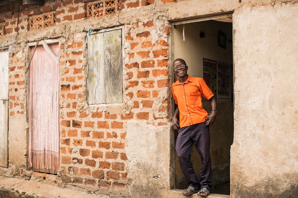 Silver standing in a doorway to his workshop