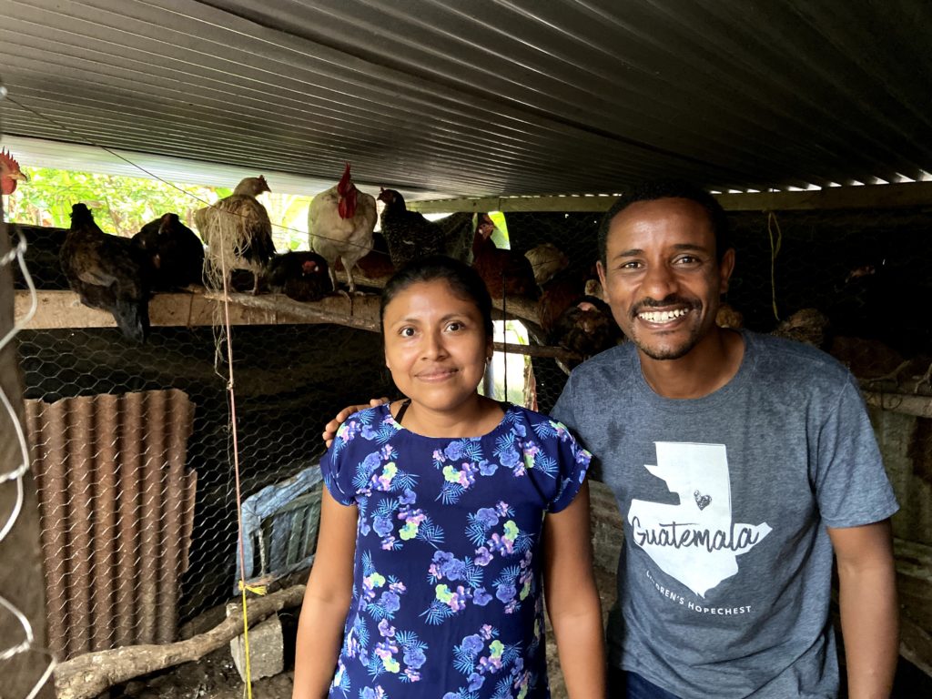 Atkelt with a woman involved with the chicken coop project.